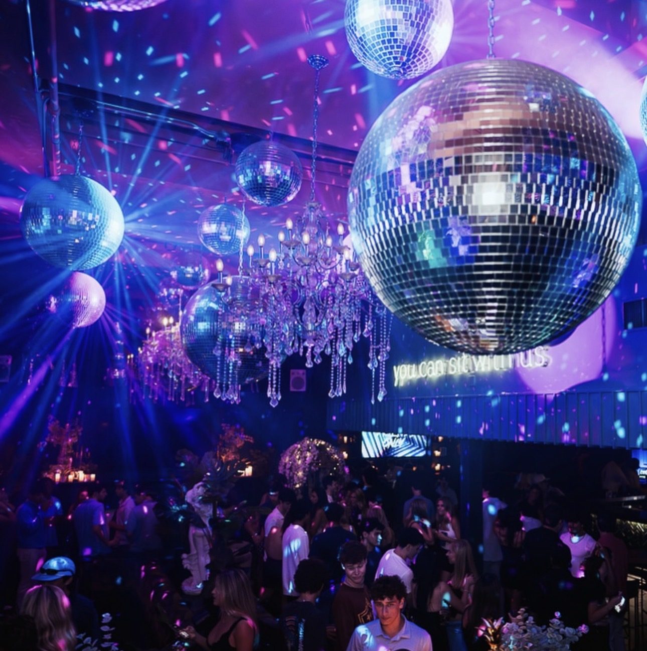 A ceiling of mirror balls over the Friends Only crowd